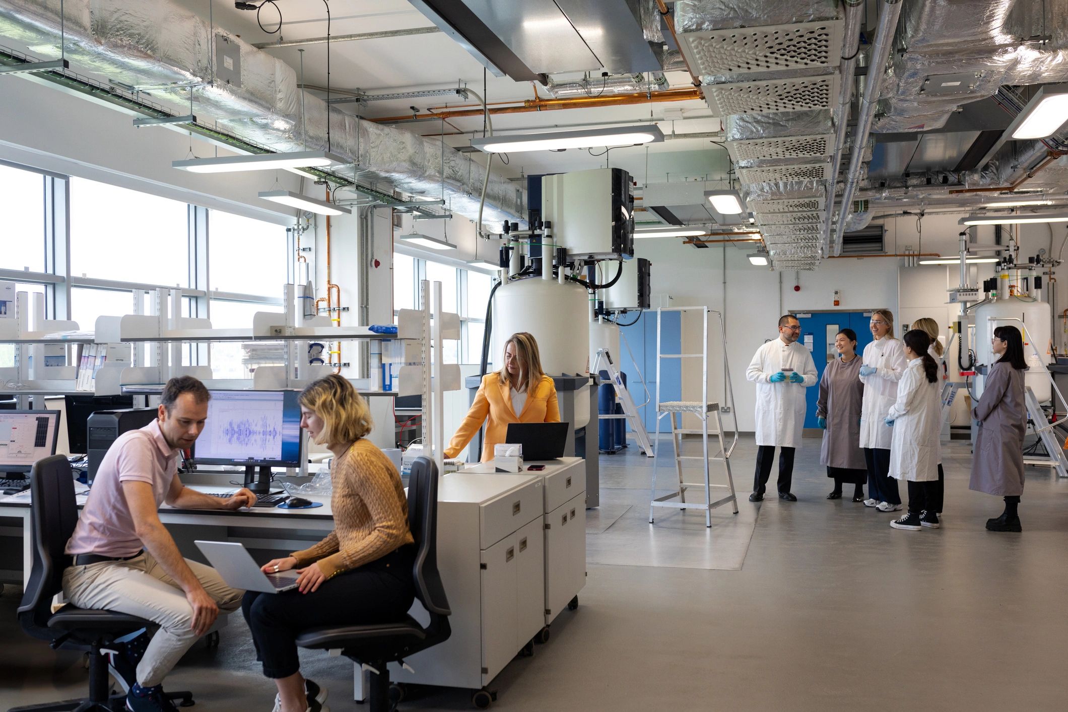 Scientists reviewing pharmaceutical data in a lab